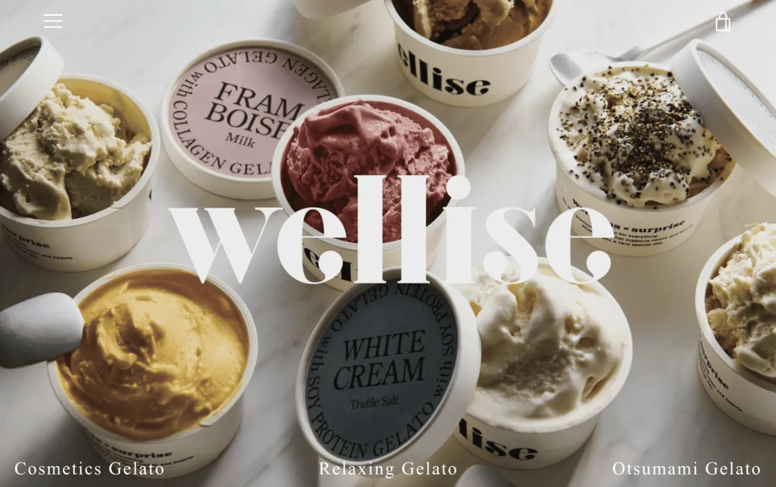 Welliseのジェラート販売ECサイト。大理石の上に並ぶジェラートと「wellise」のロゴ文字
